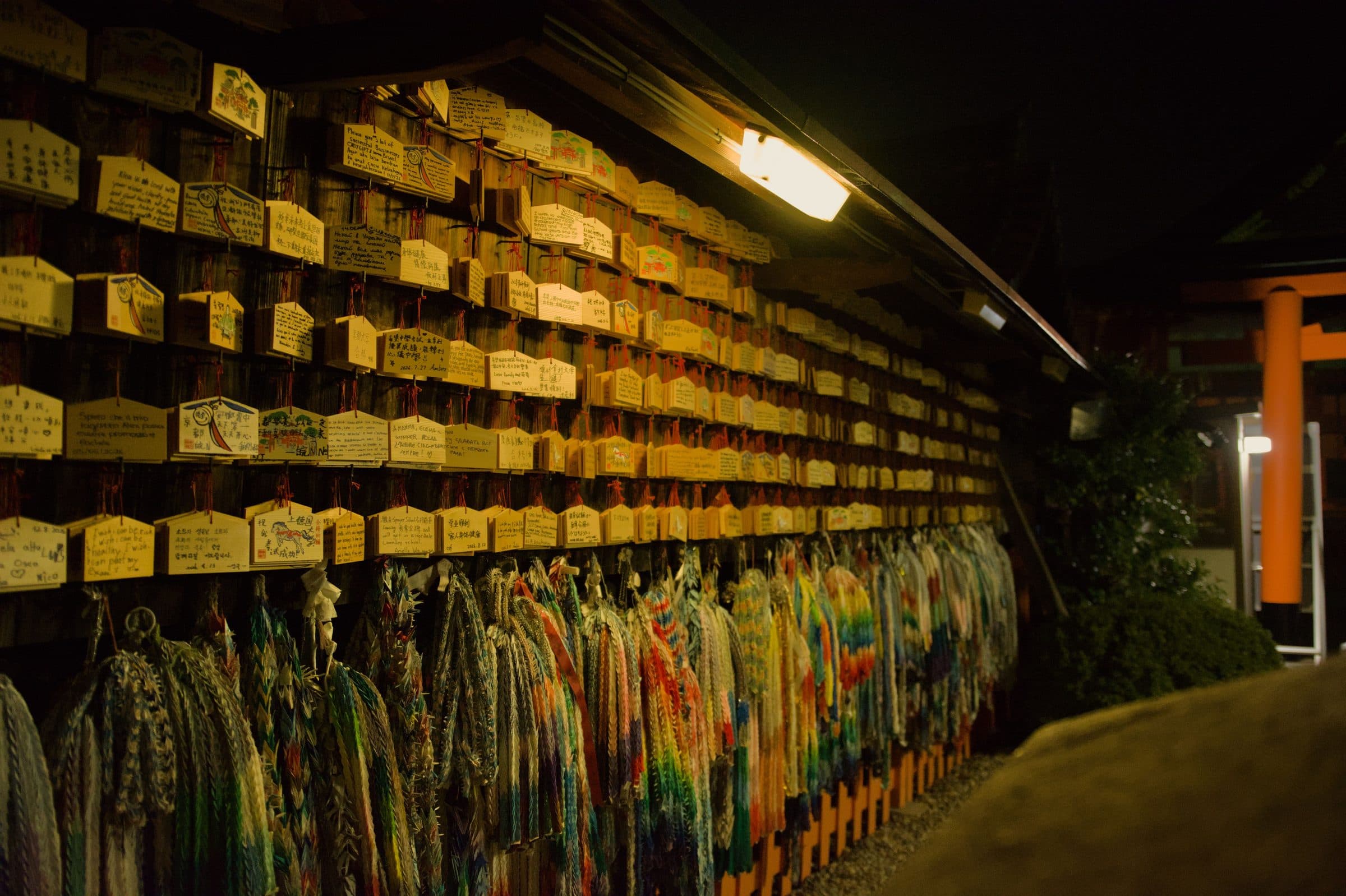 Wooden wish plaques and strings of paper cranes